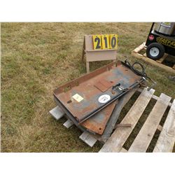 Pivot attachment for skid loader