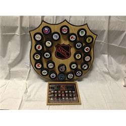 WOODEN DISPLAY OF 25 NHL TEAM PUCKS
