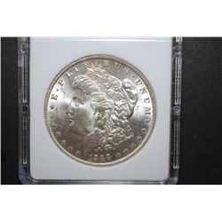 1880-O US Silver Morgan $1; MCPCG Graded MS62; EST. $45-55