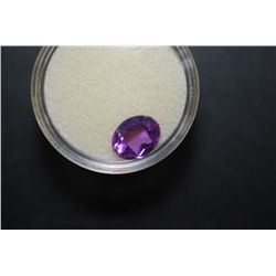 Oval-Shaped Purple Gemstone;  EST. $5-10