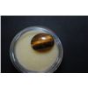 Image 1 : Oval-Shaped Tigers Eye-Like Gemstone; EST. $5-10