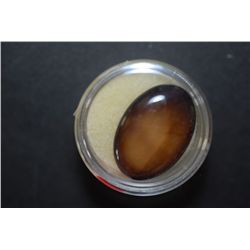 Large Oval-Shaped Tigers Eye-Like Gemstone; EST. $10-20