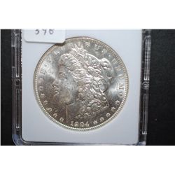 1904-O US Silver Morgan $1; MCPCG Graded MS62; EST. $50-70
