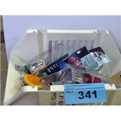 Small white plastic basket filled with assorted