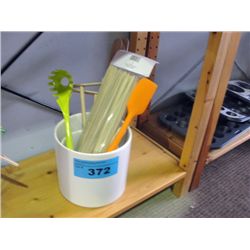 White ceramic canister filled with handy kitchen