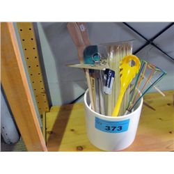 White ceramic canister filled with handy kitchen