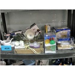 One shelf lot of new assorted kitchen tools and