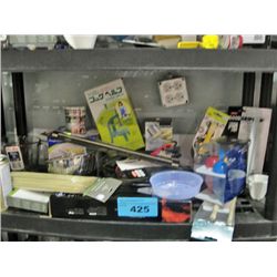 One shelf lot of new assorted kitchen tools and