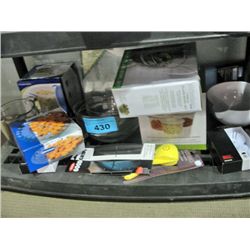 One shelf lot of new assorted kitchen tools and