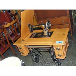 Antique singer oak cased tredle sewing machine