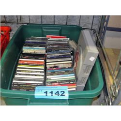 One green bin of assorted music CDs