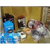 Shelf lot of ear buds, internet cable, speakers,