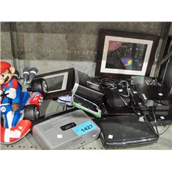 shelf lot of assorted household electronics