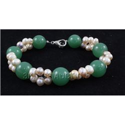 140.81CTW 8" GREEN FRESHWATER PEARL WITH CORAL BRACELET
