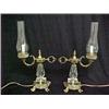 Image 1 : A pair of brass and cut crystal hurricane lamps