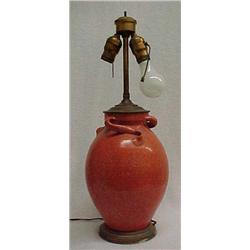Early 20th C. two light lamp, orange glazed art pottery