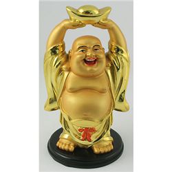 A Happy Buddha Holding Lucky Coin Bar for Wealthy Year