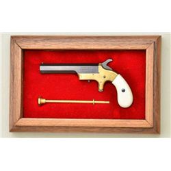 Miniature Southerner style single shot  deringer in display case with cleaning rod,  unmarked possib