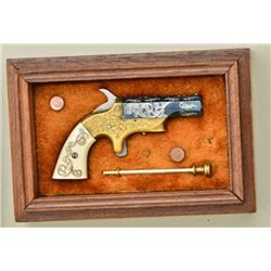 Miniature half scale Southerner Deringer,  engraved and cased with scrimshawed ivory  grips probably