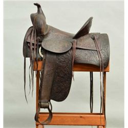 Old Western tooled leather high back saddle  by Knox & Tanner Co., Rawlings, Wyoming, in  overall go