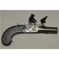 Center hammer Flintlock pistol of muff or  pocket size signed “Harcourt, Norwich”.  The  metal surfa