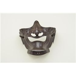 A Myochin-School Iron Menpo by Myochin  Muneharu, late Edo period, 19th century. The  russet-iron ma