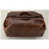 Folding leather valise approx. 21” long, 12”  wide and 9” in height with brass clasps,  leather hand