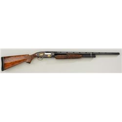 Winchester Model 12, 20 gauge pump action  shotgun fully and finely engraved in gold  inlaid by “Jud
