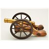 Antique small signal or noise maker cannon on  hand carved wood carriage with iron wheels,  approx. 