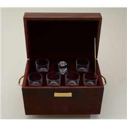 A presentation traveling bar with glasses and  decanter etched “Great Outdoors Festival”.  Plaque re