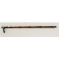 Antique European cane gun circa about 1880 in  14 gauge, black powder showing a horn grip  and bambo