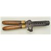 Ideal gang mold with six cavities of medium  caliber, wood handles with one showing an old  crack; m