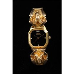 Custom sportsman’s watch featuring Sako  quartz (Japanese movement) with 10 and 24kt  gold cast sect