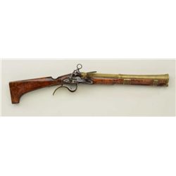 Spanish blunderbuss with miquelet lock, brass  cannon barrel, brass mountings, wood stock,  coat-of-