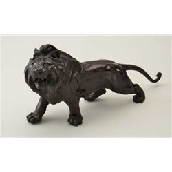 Early-to-mid 20th century Japanese bronze of  lion measuring approx. 12” in height by  21-1/2” showi