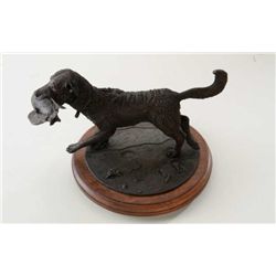 Original bronze of retriever fetching bird  signed Parton and dated 1993 on base numbered  4 of 12. 