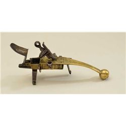Antique flintlock brass tinder lighter  approx. 7” overall and in very good condition  showing engra