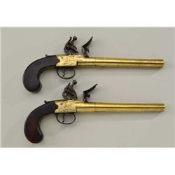 Pair of 18th century center hammer Flintlock  holster size pistols signed “Hodgson & Co.”  the pisto