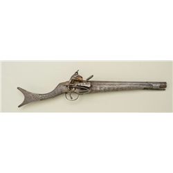 Albanian or Balkin miquelet flintlock pistol  with fishtail shaped butt and engraved iron  stock cir