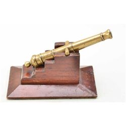 Antique canon with cast brass tube on carved  wood display mount, circa 19th century.  The  tube mea