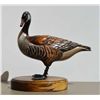 Image 1 : Art carving of duck nicely painted with  bronze feet, glass eyes, signed on base “Tom  Tab” measures