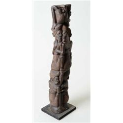 Authentic African carving measuring approx.  27-1/2” in height mounted on base showing  woman with h
