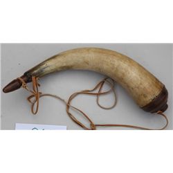 Old powder horn with light pleasing vine  carving; overall approx. 12-1/2” long with  carved wood pl