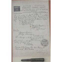 Fascinating framed and matted rifle  cartridge, headstamped “U.M.C. 6mm U.S.N.”  with note on George