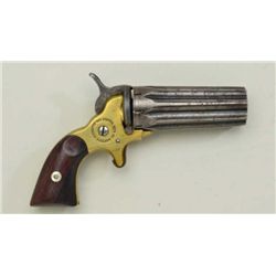 Scarce 22 cal pepperbox derringer by  “Rupertus” showing 8 shot barrel cluster,  blued finish, brass