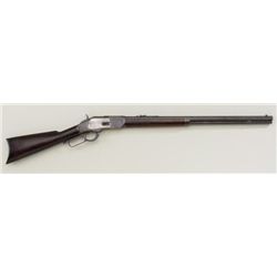 Winchester Model 1873 lever action rifle, .32  WCF cal., 24” octagon barrel, blue finish,  wood stoc