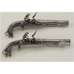Pair of Scottish style Flintlocks pistols  with rams horn shaped butts signed "MAC LEOD"  with engra