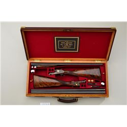 Pair of exhibition quality gold inlaid full  side lock double barrel S x S shotguns by  "John Wilkes