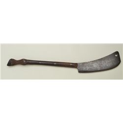 Possibly unique butcher's axe with forged  steel blade and carved wooden grip.  The  blade shows etc