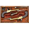 Cased pair of center hammer Flintlock pistols  with spring bayonets and constructed of  brass in ori